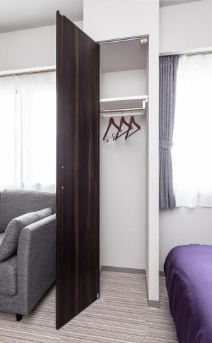 Postel nebo postele na pokoji v ubytování Hotel Classe Stay Chitose