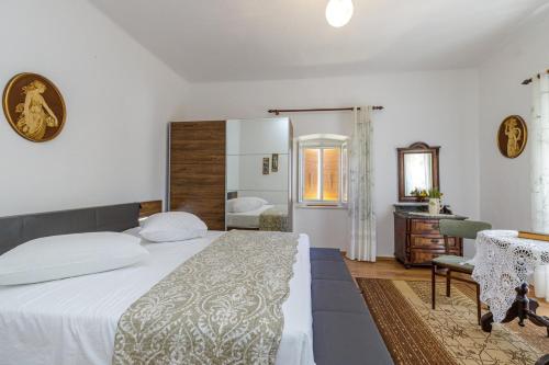 Postel nebo postele na pokoji v ubytování Apartments Štefi 869