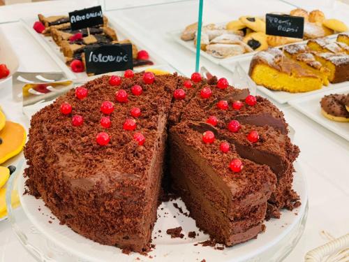 a chocolate cake on a plate on a table at Mansarda Cannes in Riccione