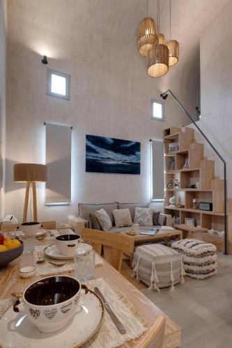 a living room with a couch and a table at Villa Anemeli in Vóthon
