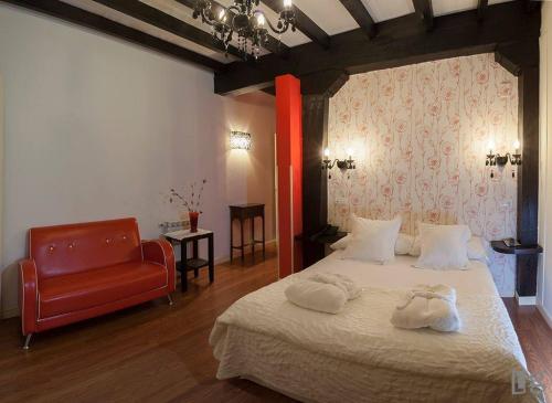 En eller flere senge i et værelse på Posada torre del milano