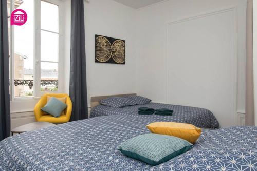Llit o llits en una habitació de Le Karijini - Hyper Centre, Poitiers
