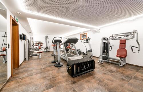 a gym with treadmills and cardio machines at Apartment S in Ehrwald