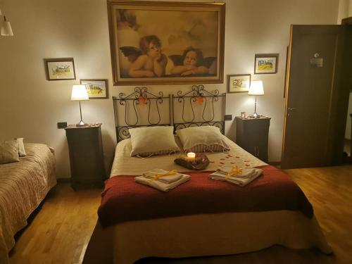 A bed or beds in a room at La Villa di Arezzo