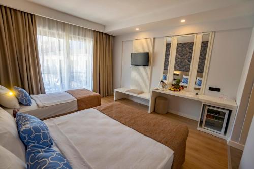 Кровать или кровати в номере Eldar Garden resort