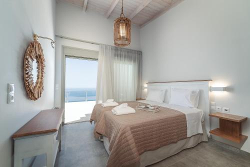 Postel nebo postele na pokoji v ubytování Owl Villas