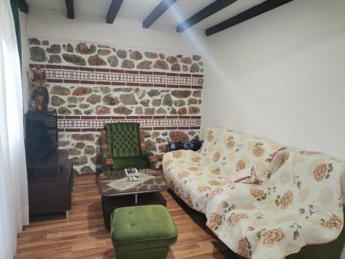 a living room with a couch and a table at Villa Sofia in Ohrid