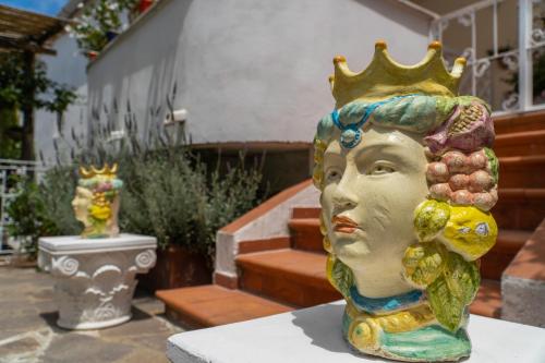 a statue of a woman with a crown on her head at Villa Iolanda in Piano di Sorrento