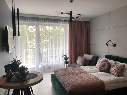 Postel nebo postele na pokoji v ubytování Apartament Lividus 210 ApartPark