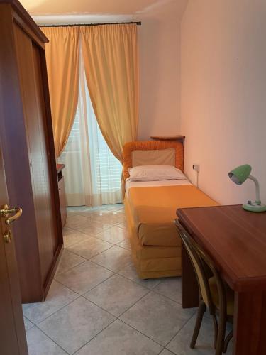 A bed or beds in a room at Il Cinghialetto