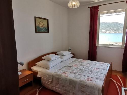 Postel nebo postele na pokoji v ubytování Apartment Vidovic
