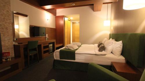 Ένα ή περισσότερα κρεβάτια σε δωμάτιο στο Abant Aden Boutique Hotel & Spa
