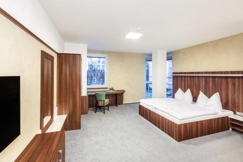 Postel nebo postele na pokoji v ubytování Graphic Hotel