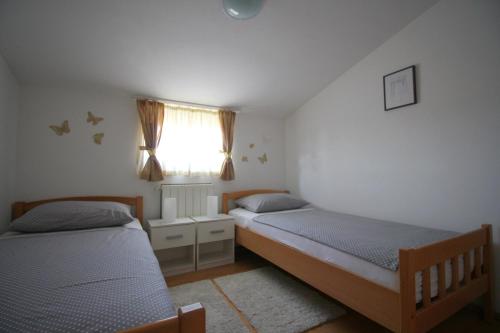 Кровать или кровати в номере Pejić Apartments