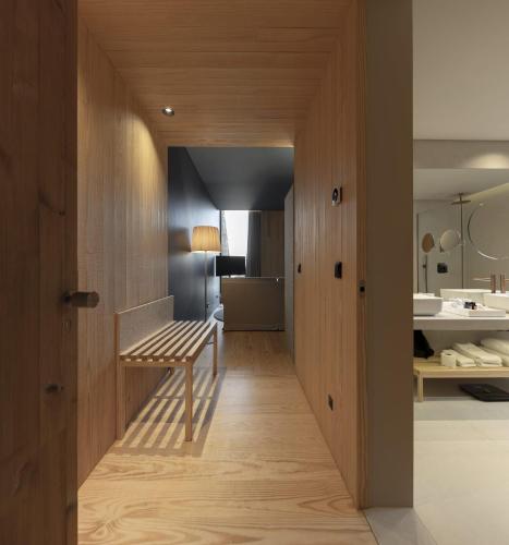 a hallway with a bench in a room at Monverde - Wine Experience Hotel - by Unlock Hotels in Amarante