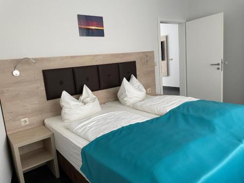 Postel nebo postele na pokoji v ubytování Hotel Steakhouse Am Rathaus