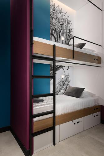a bunk bed in a room with a bunk bed in a room at Cocoon City Hostel in Chania Town