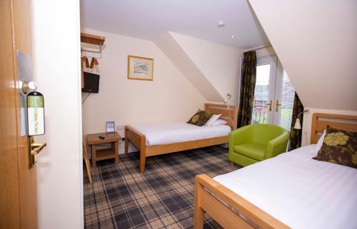 Krevet ili kreveti u jedinici u okviru objekta Braeside Guest House, Loch Lomond