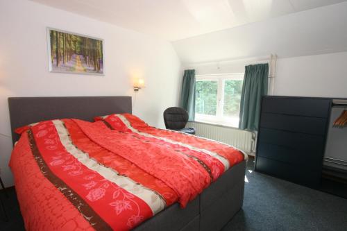 Een bed of bedden in een kamer bij Gulpdal Vakantiewoningen.