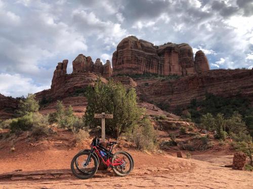 a motorcycle parked on a dirt road in the desert at Sedona Studio at Thunder Mountain in Sedona