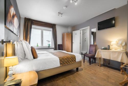 Postel nebo postele na pokoji v ubytování Hotel Maraboe