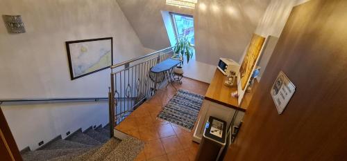 a staircase in a house with a stair case at Villa Kapitańska in Kołobrzeg