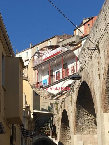 a reflection of a building in a mirror on a bridge at La Vista in Calitri