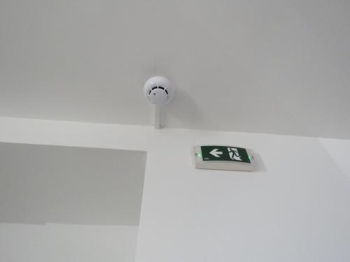 a sign on the side of a door with a camera at Aquamarine Sea Front Apartments - Second Floor in Marsaskala
