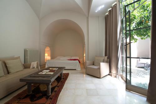 a living room with a couch and a table at Les Deux Tours in Marrakech