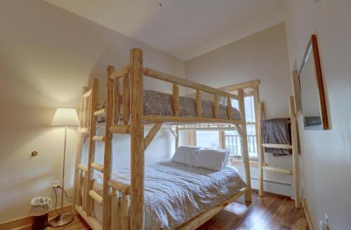 a bedroom with two bunk beds in a house at CS407 Copper Springs condo in Copper Mountain