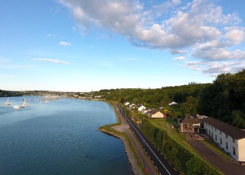 an aerial view of a river with houses and boats at Whispering Pines in Crosshaven