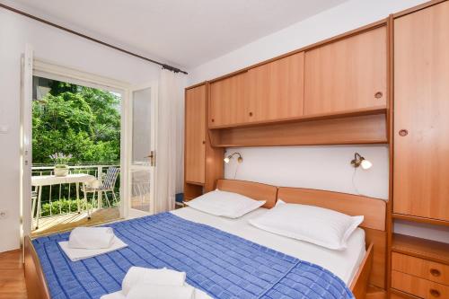 Postel nebo postele na pokoji v ubytování Apartmani Marija - Nada