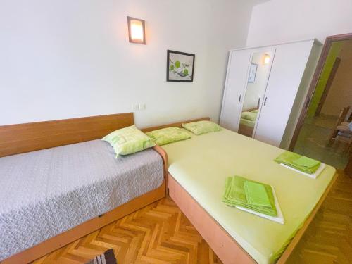 Posteľ alebo postele v izbe v ubytovaní Apartmani Dea