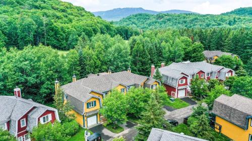 an aerial view of a home with houses at Townhouse With Free Shuttle To Tremblant Resort in Mont-Tremblant