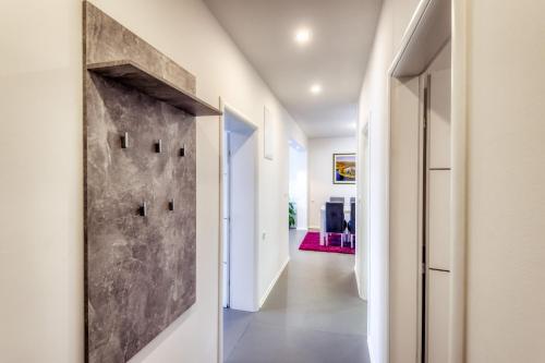 a hallway with a door leading into a room at Apartment Sea bass Neretva in Ploče