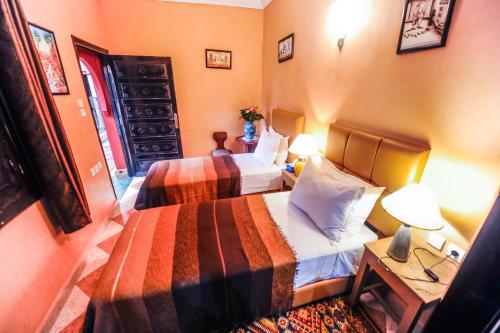 Postel nebo postele na pokoji v ubytování Riad Errabii & Spa