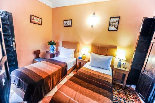 Postel nebo postele na pokoji v ubytování Riad Errabii & Spa