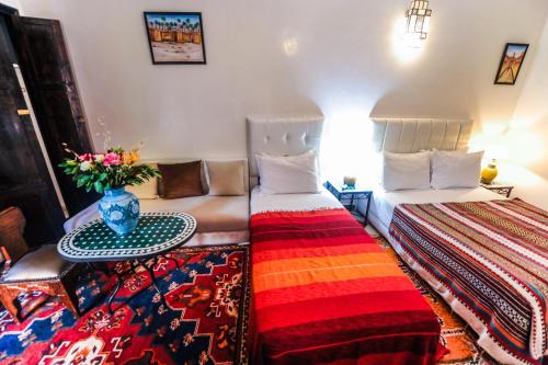 Postel nebo postele na pokoji v ubytování Riad Errabii & Spa