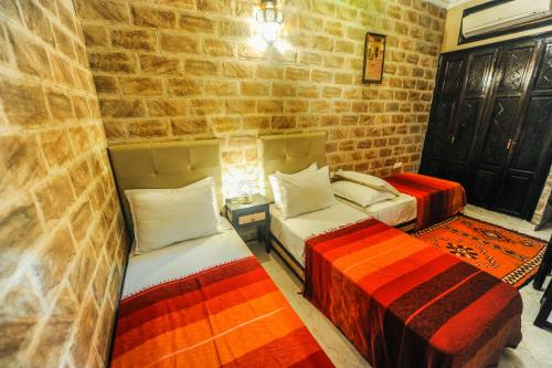 Postel nebo postele na pokoji v ubytování Riad Errabii & Spa