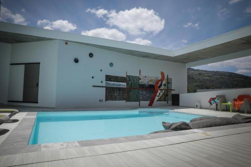 a house with a swimming pool in a room at Casa Das Condessinhas in Lousã