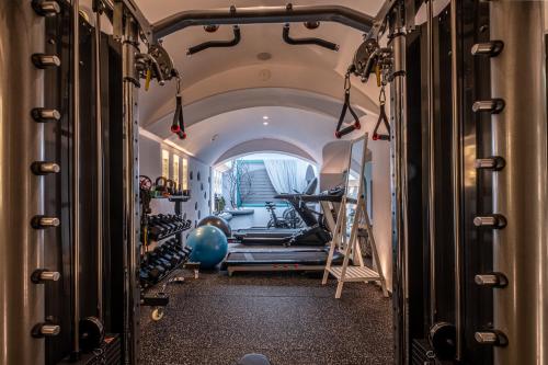 a gym with a row of tread machines at Anastasia Princess Luxury Beach Residence, Adults Only in Perissa