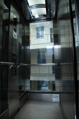 a view of a building through a glass door at Aselefech Merga Hotel and Spa in Addis Ababa