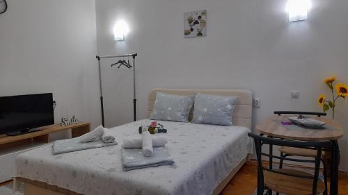 Ένα ή περισσότερα κρεβάτια σε δωμάτιο στο Relax Apartmani Niš