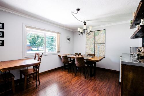 a dining room with a table and chairs at Alpenrose Revelstoke Bed & Breakfast in Revelstoke