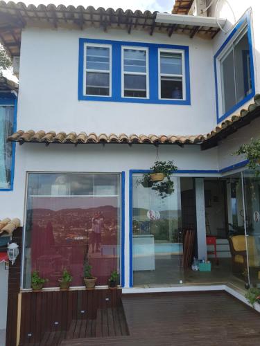 a house with blue doors and windows at Top de Buzios Boutique Hotel & Spa in Búzios