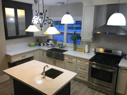 a kitchen with a sink and a stove at WHITE SWAN House in Niagara Falls