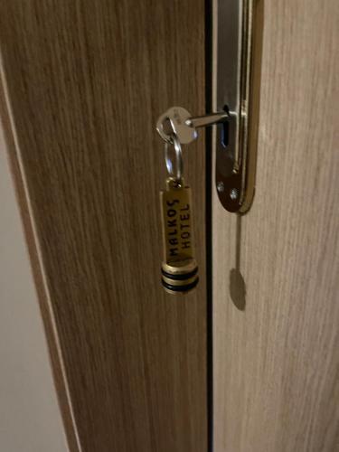 a door with a key in the middle of it at Bursa Malkoc Hotel in Bursa