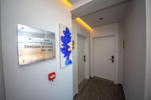 a hallway with two posters on a wall at Apart-Hotel Lili2 in Sarandë