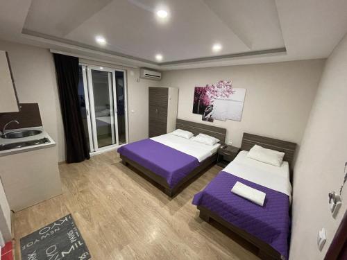 מיטה או מיטות בחדר ב-Apartments Lati
