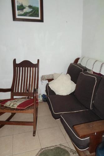 a living room with a couch and a chair at La Casona de Susana in Colón